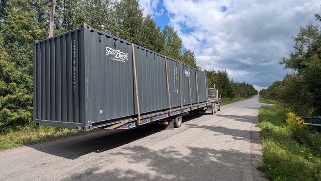 Shipping container on a flatbed truck